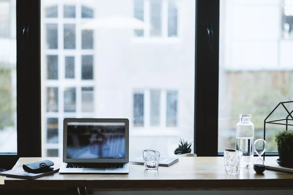 Laptop on a desk in a modern office workspace